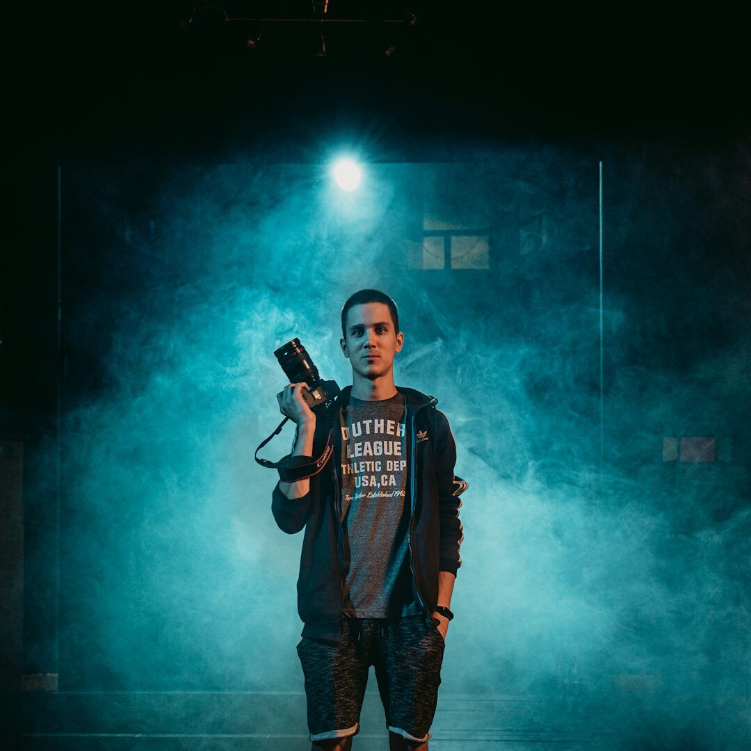 Studio portrait of a woman holding a microphone