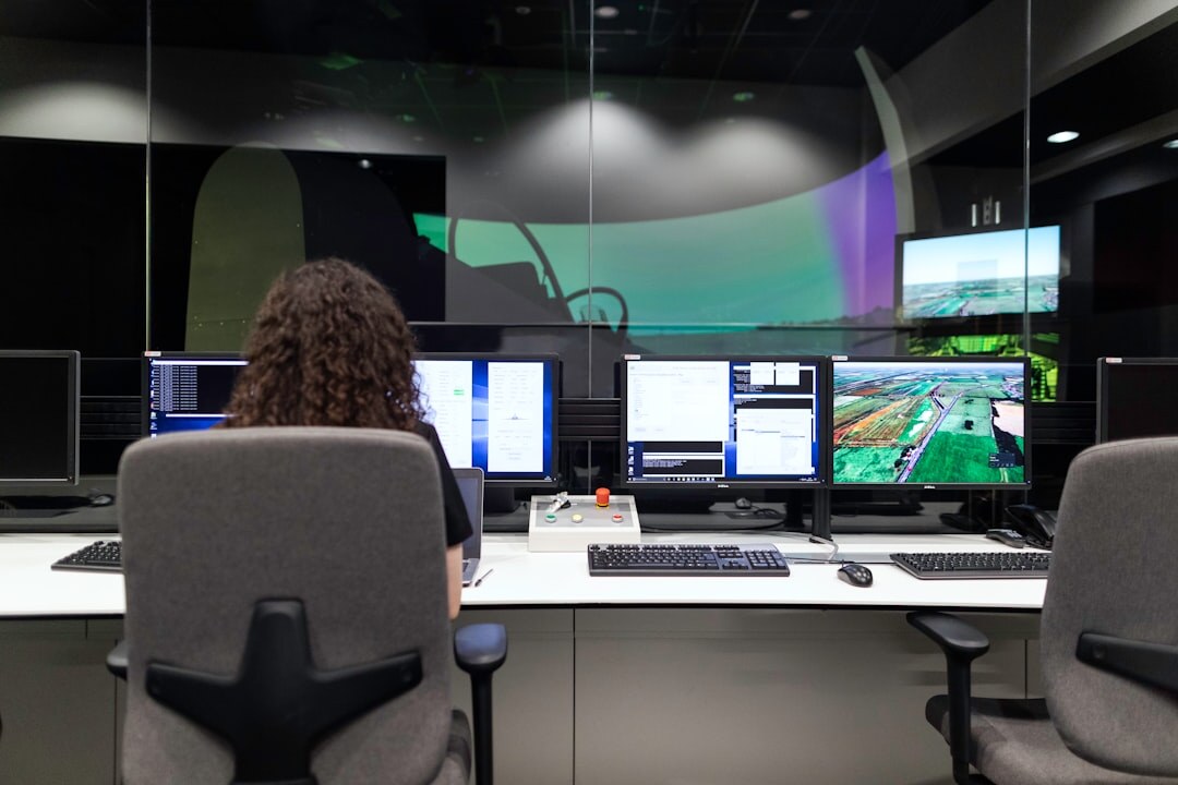 Television newsroom with multiple screens and desks